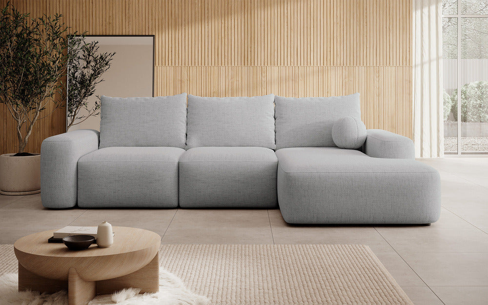 Kampinė sofa LIVA, pilkas šenilas, su kamuoliuku