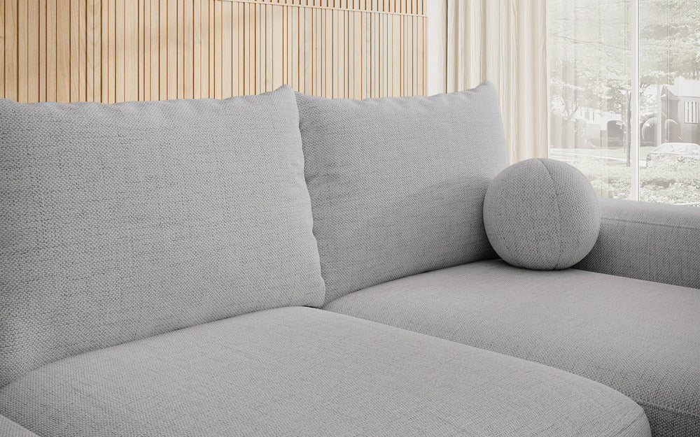 Kampinė sofa LIVA, pilkas šenilas, su kamuoliuku