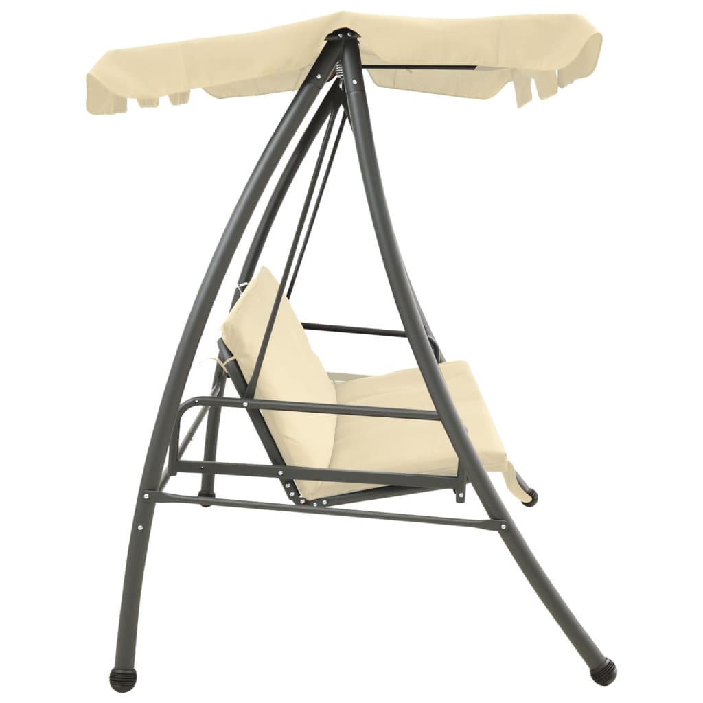 Outdoor swing with a canopy, sand and white