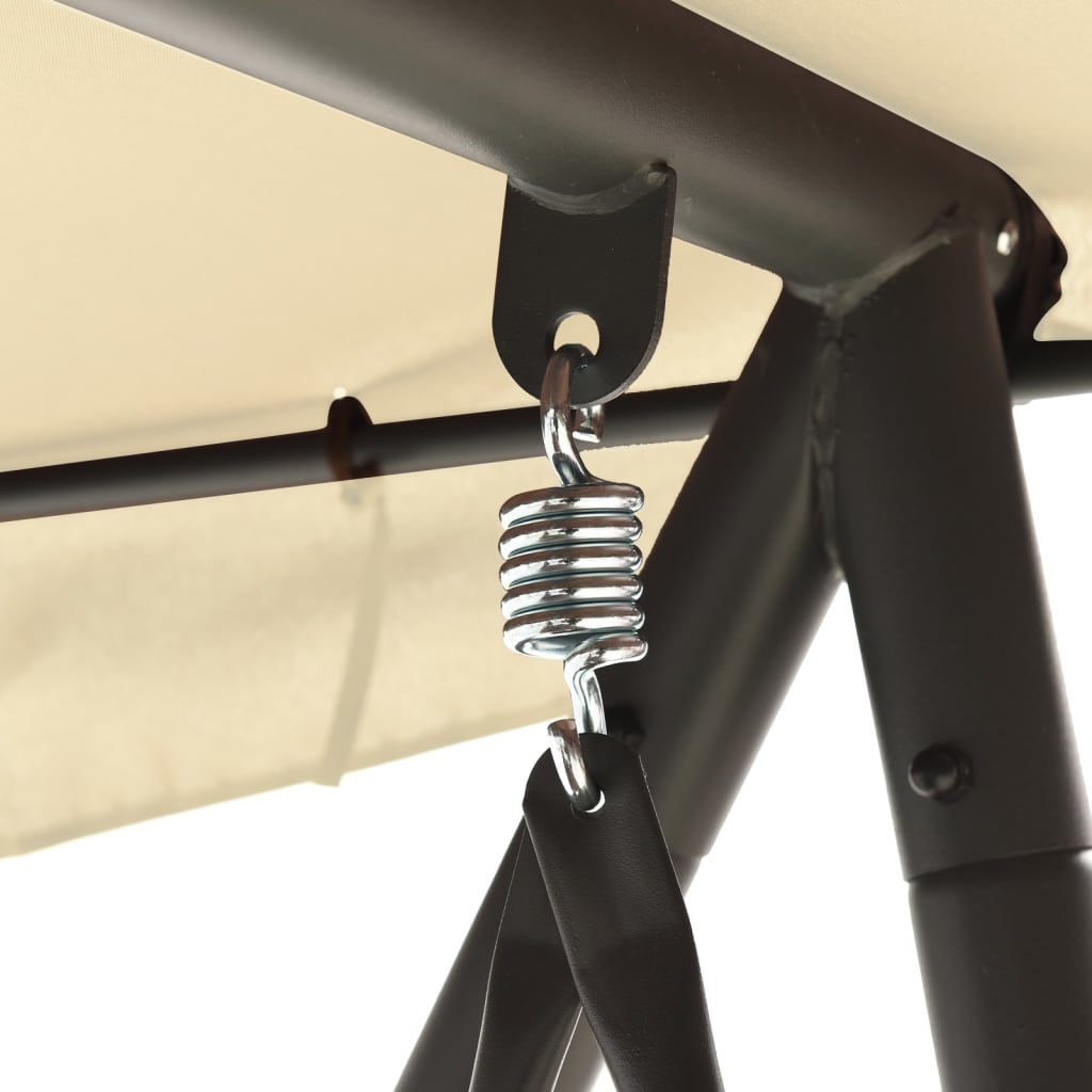 Outdoor swing with a canopy, sand and white