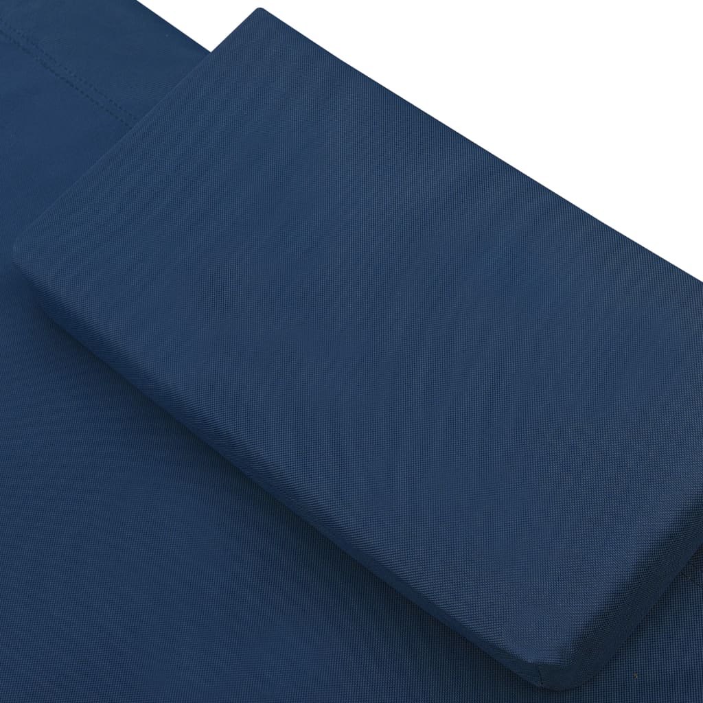 Outdoor lounge bed with canopy and pillows, blue