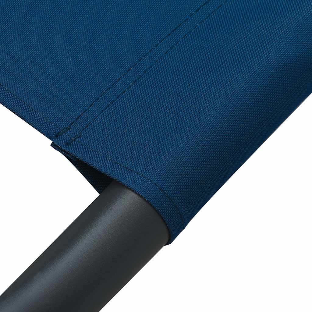 Outdoor lounge bed with canopy and pillows, blue
