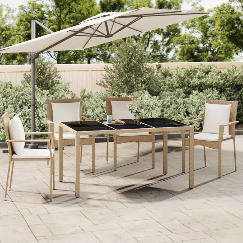 Table with a glass top, sand, poly rattan and glass