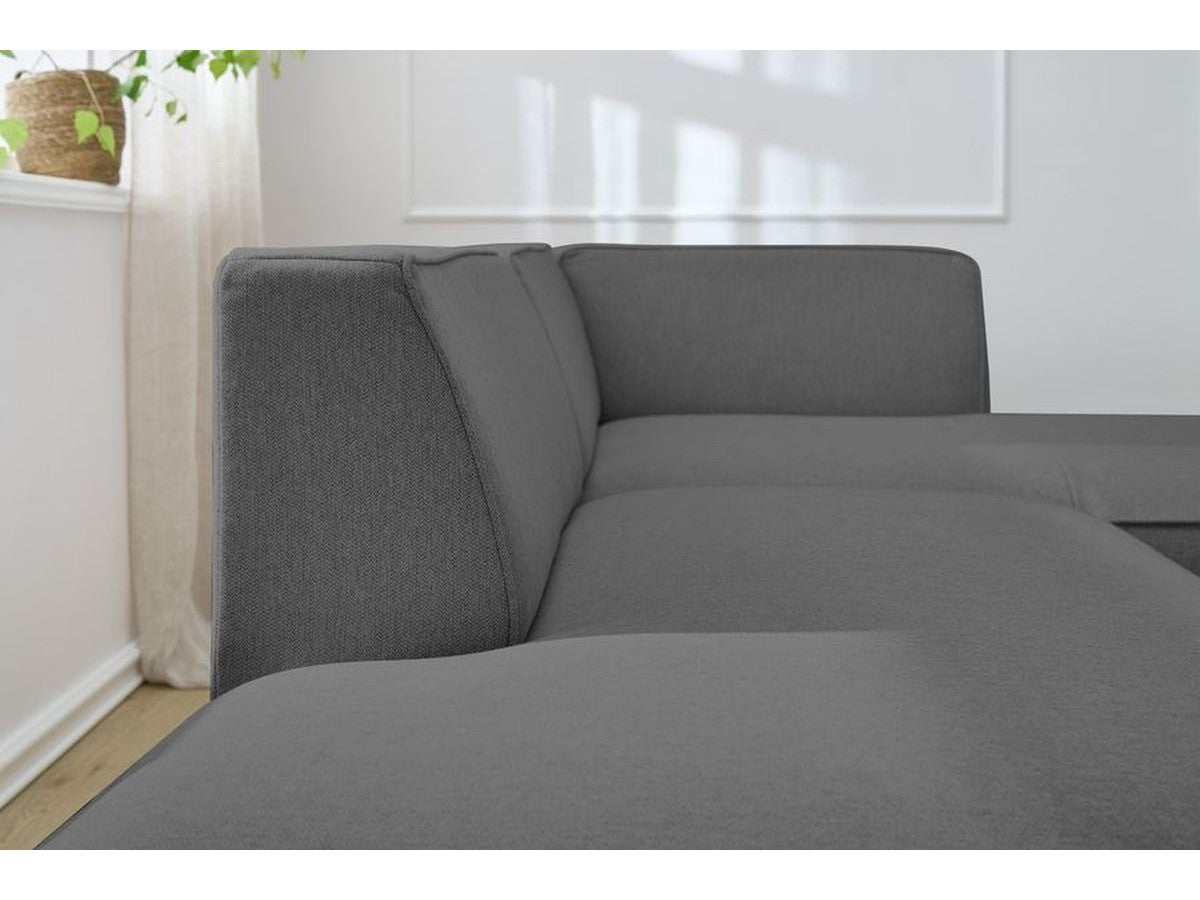 Tamsiai pilka kampinė sofa MEGEVE su gilia sėdima dalimi