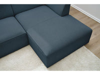 Tamsiai mėlyna kampinė sofa MEGEVE su gilia sėdima dalimi