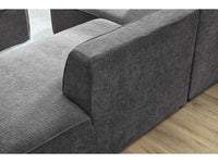 Kampinė sofa MEGEVE tekstūrinis tamsiai pilka dešinė kojelių detalė