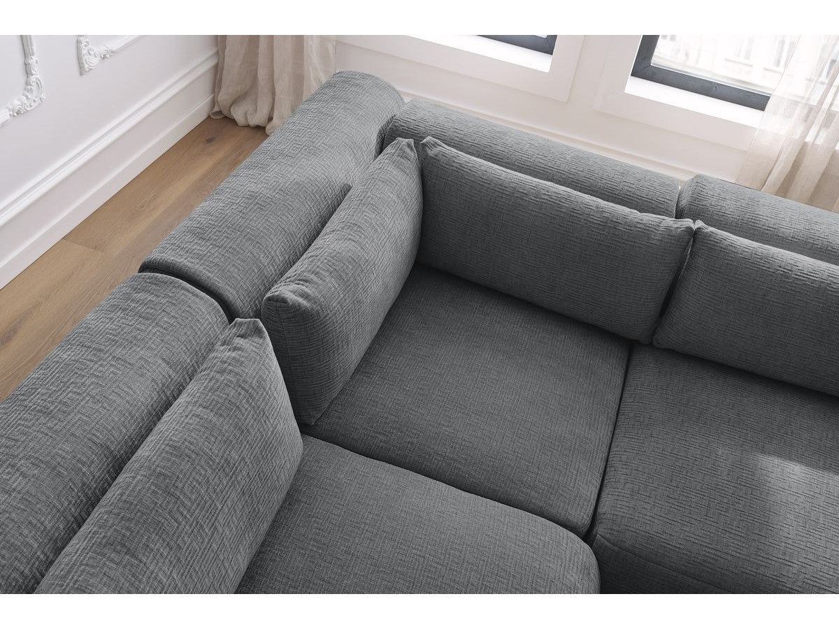 Kampinė sofa JEANNE, 2 moduliai + kampas + 2 pufai, tamsiai pilka svetainės interjere