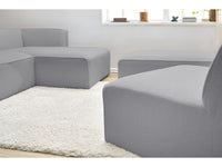Kampinė modulinė sofa MEGEVE bouclé šviesiai pilka dešinė su foteliu ir pufu detalė iš arti