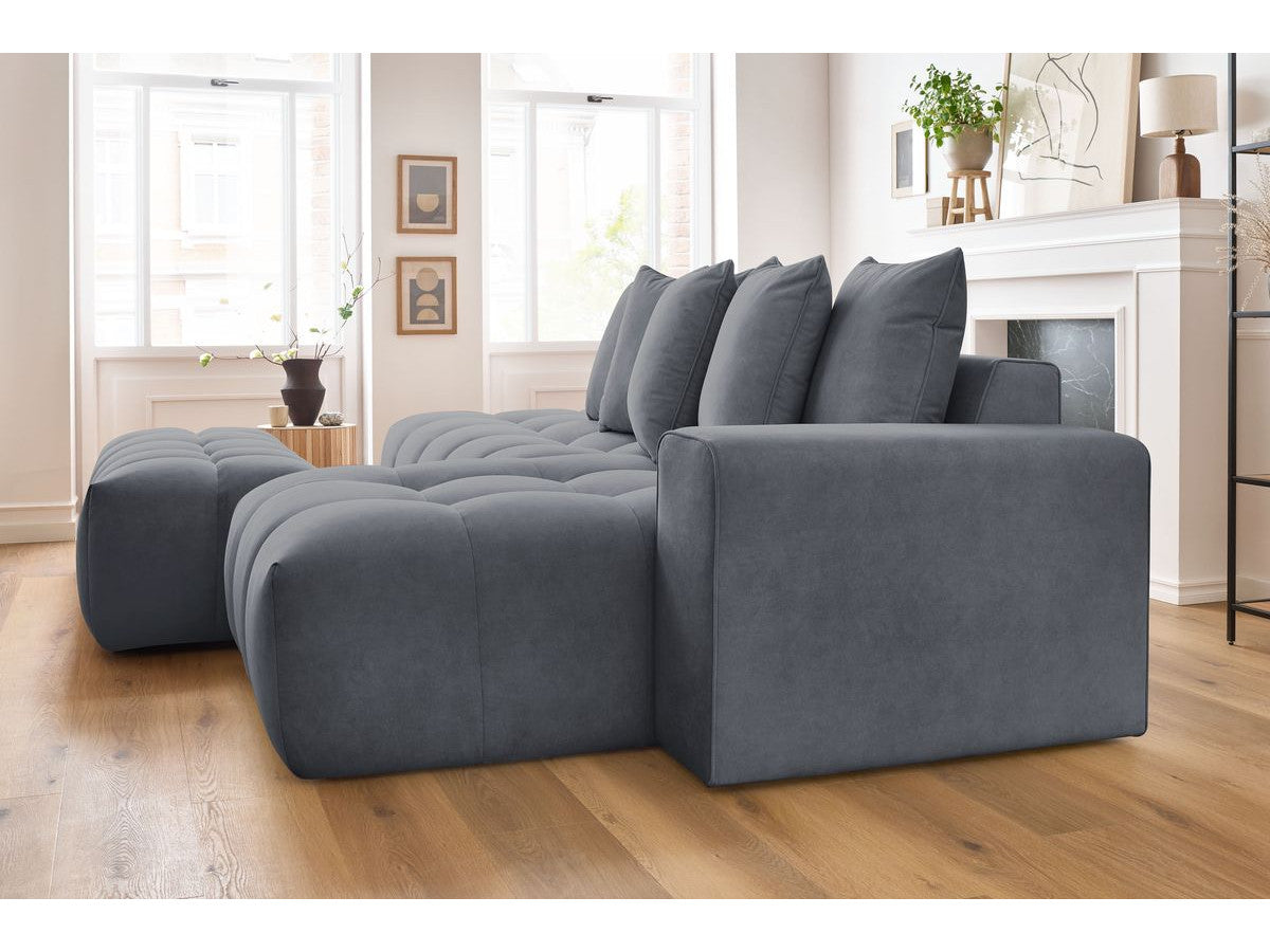 Kampinė sofa MONT-BLANC su pufu, veliūras, tamsiai pilka moderniame interjere