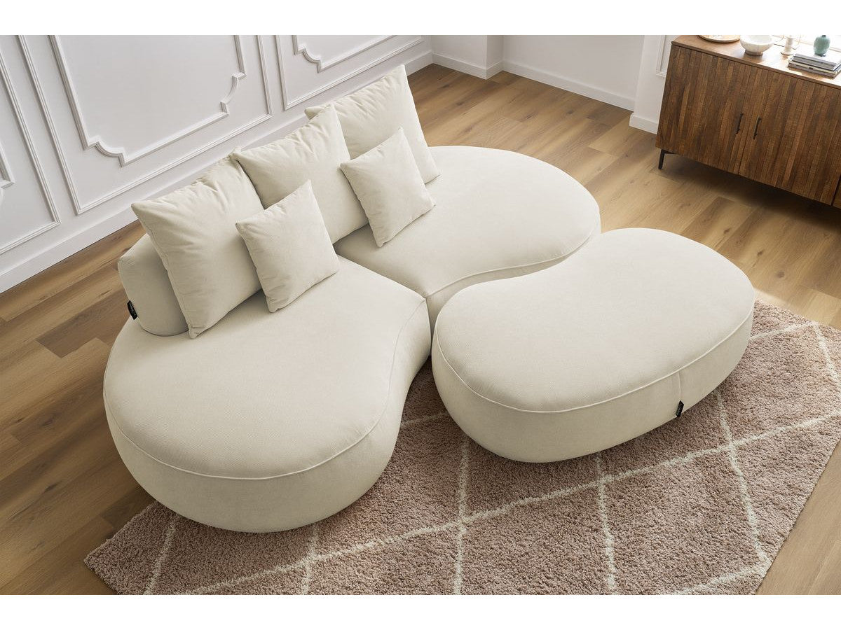 Sofa 3 vietų SAINT-GERMAIN su pufu, smėlinė šalia kavos staliuko