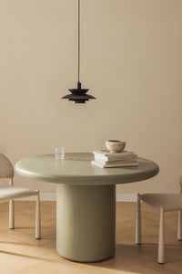 Apvalus cementinis valgomojo stalas NAVAARO moderniame interjere